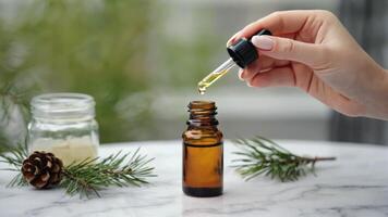 Aromatherapy essence being dripped into a bottle for holistic wellness photo