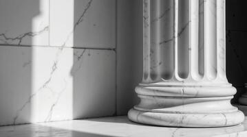 Elegant classic marble column with strong shadows and texture photo
