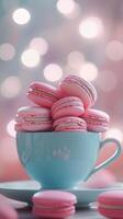 Teal teacup overflowing with pink macarons, set against dreamy bokeh background, creating visually appealing dessert scene. Dessert concept photo