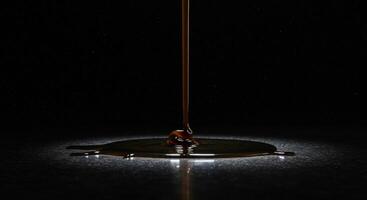 Dark Liquid Pouring on Surface photo