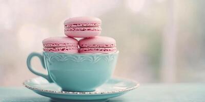 Pink macarons in pastel teal teacup, creating sweet and charming scene perfect for dessert presentations. Food concept photo