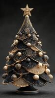 Unique black and gold Christmas tree displaying artistic design and festive decorations photo