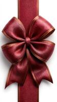 Elegant red ribbon bow with a shiny finish tied on a textured background for festive decorations or gift wrapping events photo