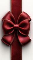 Beautiful red ribbon bow on a textured background perfect for gift wrapping or decorations during festive celebrations photo