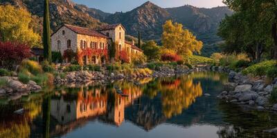 Beautiful countryside landscape with a river reflecting autumn colors and historic building in the background near vineyards photo