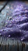 Shimmering purple glitter on rustic wooden surface creates a magical cosmic atmosphere photo