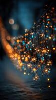 Decorative string lights illuminate a winter evening, casting a warm glow on a cold urban street photo