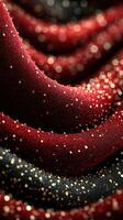 Textured red and black fabric with sparkling highlights glistens under soft light during a creative design session photo