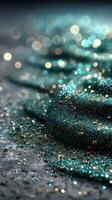Captivating turquoise and gold glitter creating a shimmering effect on a textured surface in ambient light photo