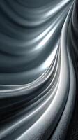 Elegant flowing fabric illuminated by soft light creates a mesmerizing wave pattern in shades of gray and silver photo