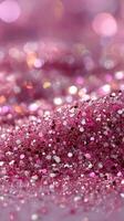 Shimmering pink glitter spreading across a surface in a vibrant display of colors and textures photo