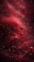Red abstract texture displaying dynamic spheres and particles shining in a cosmic background with a luminous glow photo