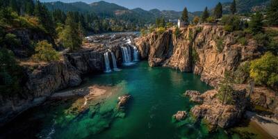Waterfall cascading into a serene river surrounded by rugged cliffs and lush greenery on a sunny afternoon photo