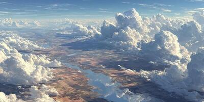Expansive view of fluffy clouds over tranquil river and farmland during midday light photo