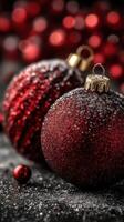Decorative red Christmas ornaments resting on a glittery surface during the holiday season photo