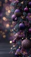 Purple-themed Christmas tree adorned with ornaments and flowers creates a festive atmosphere in a cozy setting during the holiday season photo