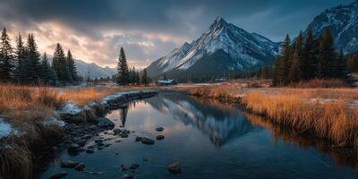 Mountain landscape at dusk with a tranquil river reflecting the sky and surrounding trees in autumn photo