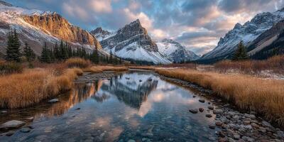Scenic mountain landscape with a reflecting river at sunset in a serene national park photo