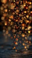 Golden orbs cascade through a dark background creating a mesmerizing effect of light and color photo
