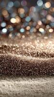 Sparkling surface with golden and silver glitter in soft focus, creating a festive and elegant atmosphere during a celebration photo
