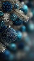 Decorative blue ornaments on a frosted tree create a winter wonderland atmosphere during the holiday season photo