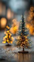 Miniature Christmas tree adorned with lights sparkles in a festive evening setting photo