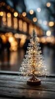 Sparkling holiday tree illuminated at a festive market during winter evening twilight photo
