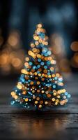 Holiday lights illuminate a small decorative Christmas tree in cozy indoor setting during festive season photo