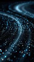 Dynamic flow of blue particles creates a mesmerizing visual effect in a dark atmosphere photo