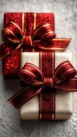 Colorful holiday gift boxes with shimmering ribbons on textured surface for festive season celebration photo