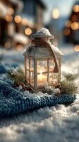 Winter lantern illuminated in snowy setting with greenery during festive season photo
