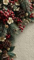 Decorative holiday arrangement with pine, berries, and flowers on rustic background photo