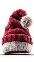 Festive red and gray holiday hat with pom pom displayed on a neutral background photo