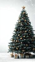 Beautifully decorated Christmas tree with golden ornaments and gifts in a snowy setting photo