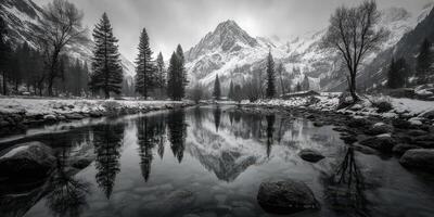 Winter landscape with snow-covered mountains and reflective river at dawn in a serene valley photo