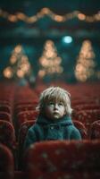 Young child gazing upward in a theater filled with softly lit holiday decorations during a winter evening event photo