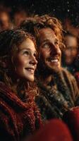 Joyful moments during a snow-filled outdoor event with children and adults smiling together at night photo