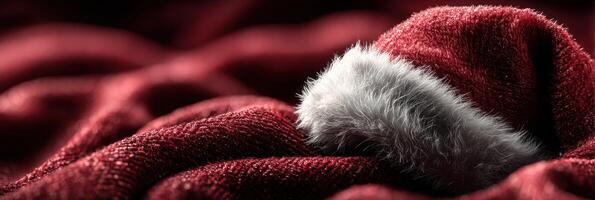 Cozy red fabric with a soft white fur trim evokes warm holiday feelings during winter celebrations photo