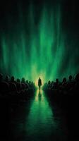 Dramatic silhouette stands against vibrant green backdrop in a dark theater filled with viewers photo