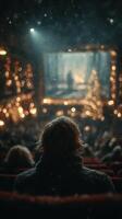 Festive winter movie night with a captivated audience in a cozy theater adorned with lights and decorations photo