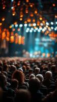 Crowd enjoying a live music concert with bright lights and vibrant atmosphere in an indoor venue photo