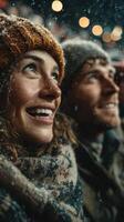 Couple enjoying the snowfall during a festive winter celebration in a cozy outdoor setting photo