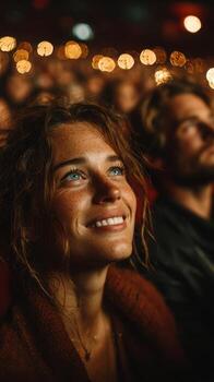 Excitement and Joy During a Live Performance at Night in a Crowded Venue photo