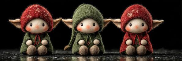 Whimsical elf figurines in colorful outfits sitting together on a dark surface photo