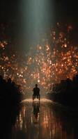 Person in wheelchair illuminated by light amidst audience in a dark setting during an event photo