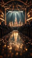Audience enjoys a festive performance in a beautifully decorated theater with glowing lights and a shimmering floor during the holiday season photo