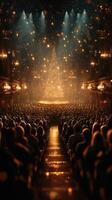 Crowd gathered to celebrate the holiday season in a grand theater with a dazzling Christmas tree photo