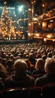 Audience enjoying a dazzling performance in a beautifully decorated theater during the evening photo