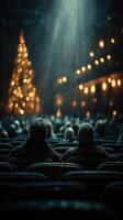 Couples enjoy a cozy winter evening by the glowing Christmas tree in a bustling theater filled with holiday spirit photo