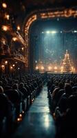 Holiday performance with audience in historic theater decorated for Christmas celebration taking place in evening hours photo